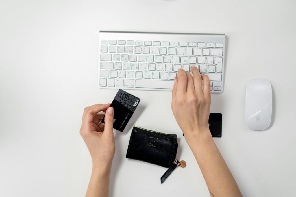pexels photo 3944405 3944405 E-commerce setup featuring a keyboard, card, and wallet, ideal for online shopping concepts.